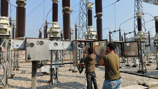 Engineers testing a circuit breaker marshalling box in the switchyard