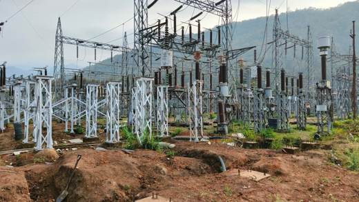 Concrete switchgear foundations next to newly erected steel structures